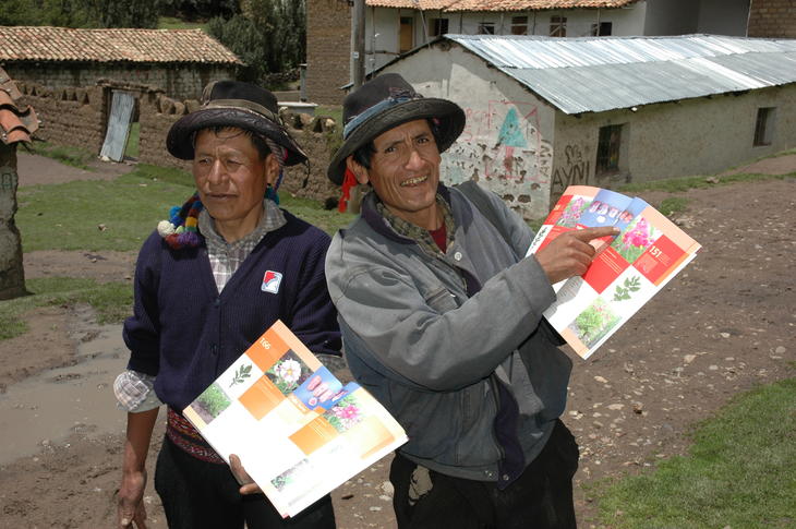 Farmers with a potato catalogue in Peru. Photo: Stef de Hahn